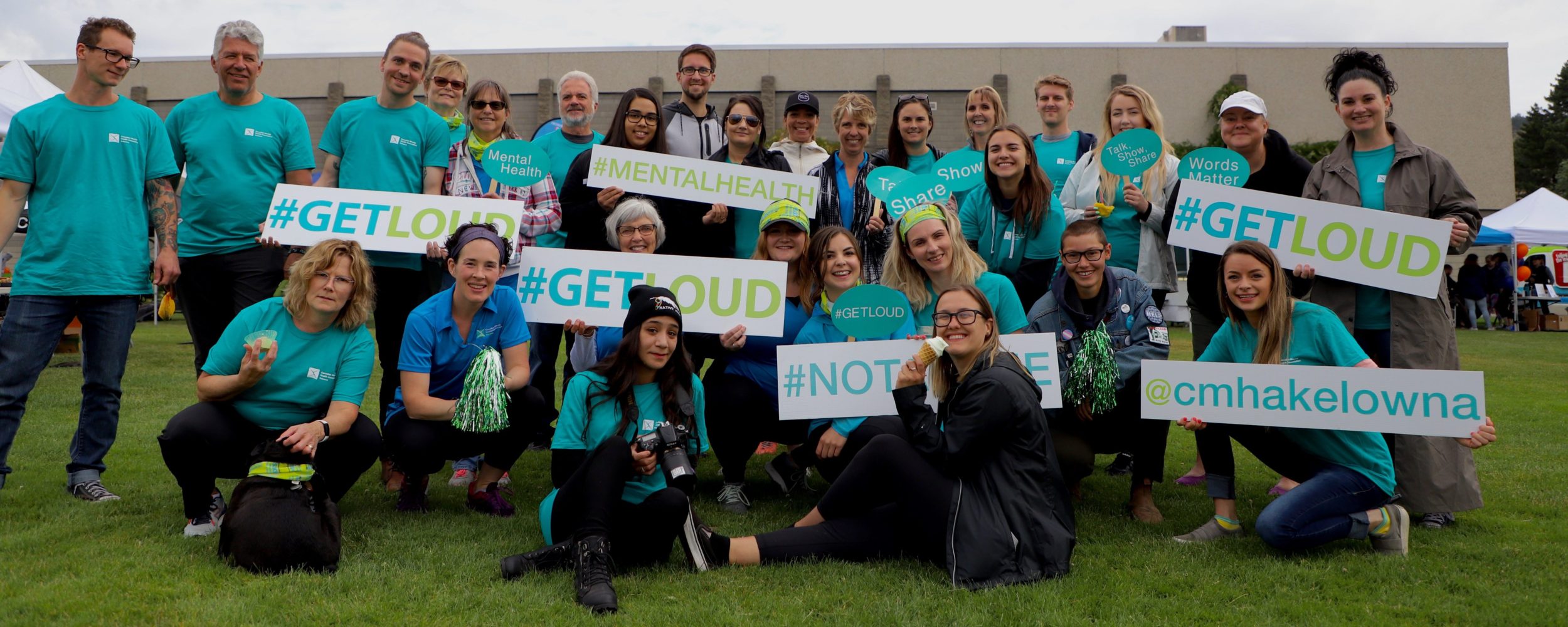 Group volunteer photo for # Get Loud for mental health Group volunteer photo for # Get Loud for mental health everyone wearing CMHA blue get loud shirts and lots of signs for mental health
