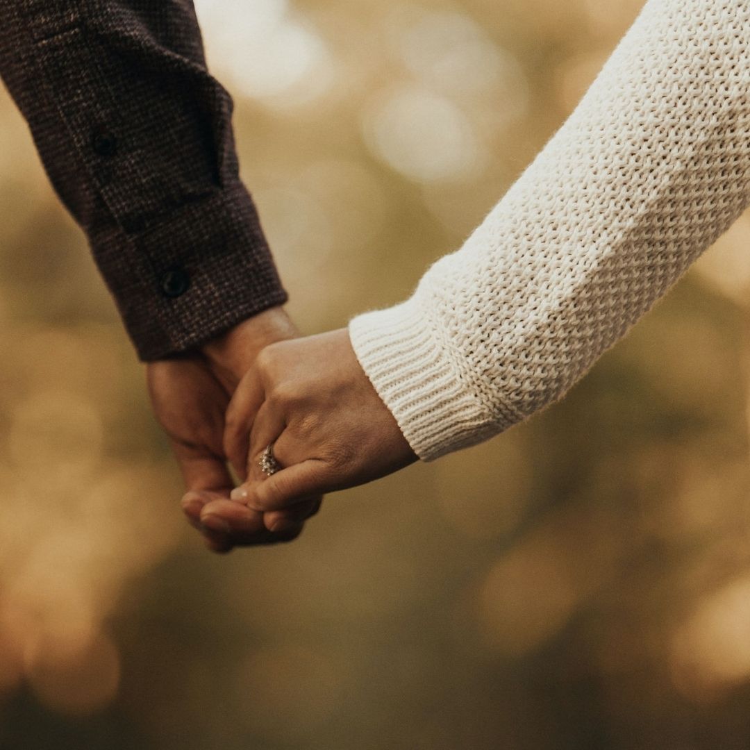two people holding hands in a very generous fashion