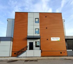 Ellis Place CMHA Kelowna supportive housing CMHA's newest supportive housing unit, a brown and grey modern looking modular building on a cloudy day