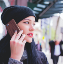 Woman on her cell phone booking a virtual appointment with foundry Kelowna