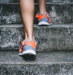 Legs and feet climbing up stairs, Exercise, and activity are important for your mental health!