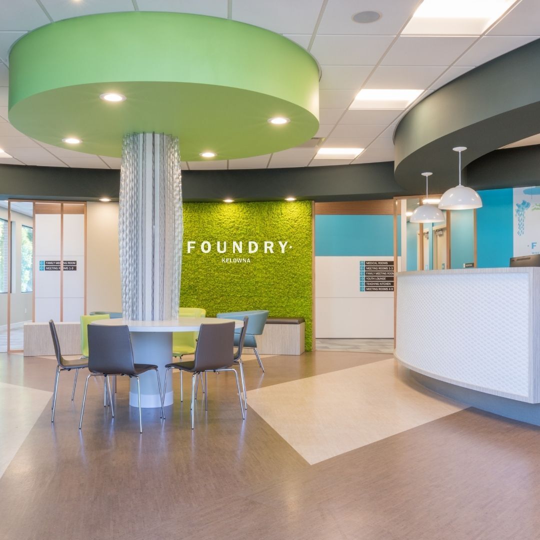 Inside the front doors of foundry Kelowna, a lovely and calming office with baby blue and light green colouring